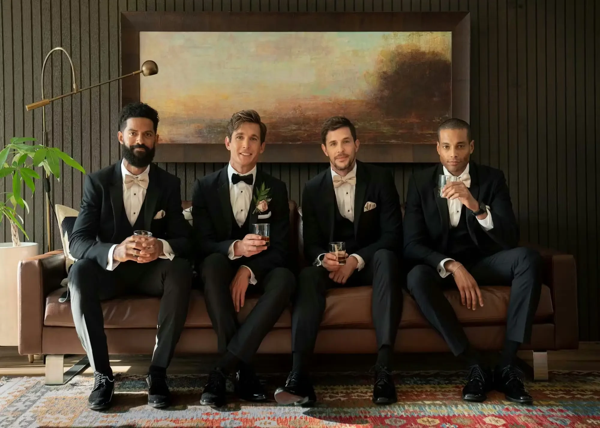 Models wearing tuxedos